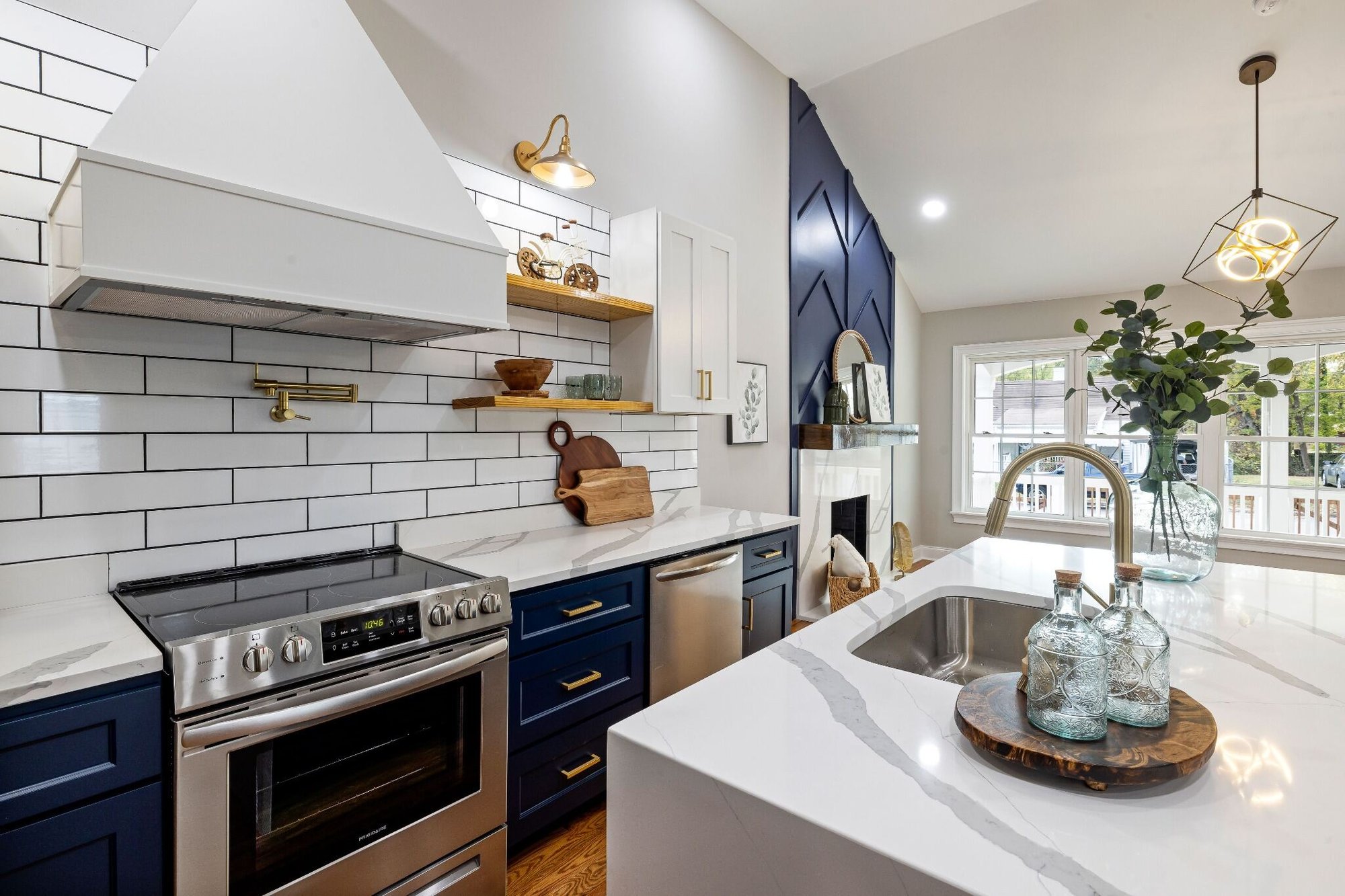 Stock image of blue and white kitchen with quartz counters, subway tile, and open shelving northern california -optimized
